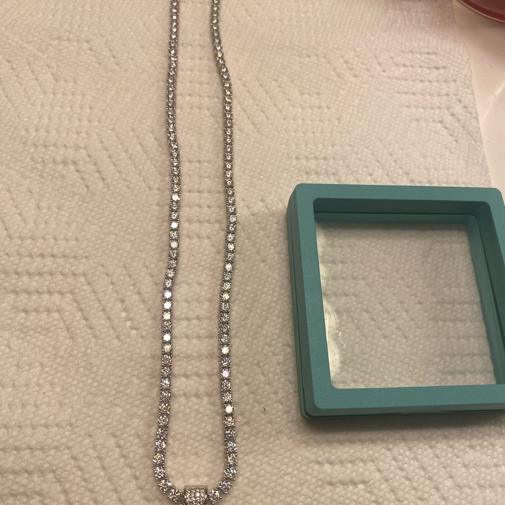 Mens 24 inch sterling silver 4mm mossanite tennis chain. Have to see in person.